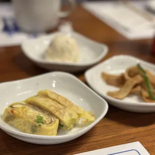 three plates of food on a table