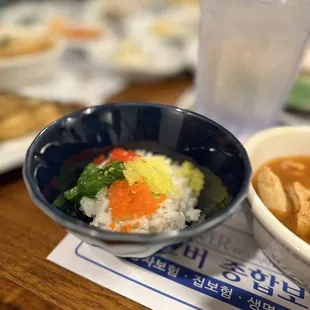 a bowl of soup and a bowl of rice