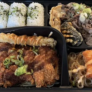 DosiRock Platter Chicken katsu, shrimp katsu stick, shrimp tempura, bulgogi, chicken dumpling, seaweed roll, japchae noodles, seasoned rice