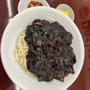 a bowl of noodles and mushrooms