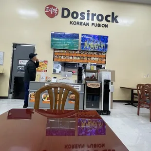 Inside (inside grocery store). Enter store go far left, in front