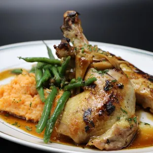 a plate of food with meat and vegetables