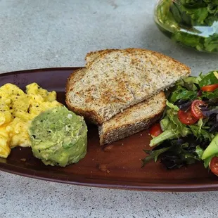 Eggs and toast with a side of avocado