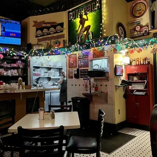a restaurant with tables and chairs