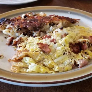 Ham and cheese omelet and home fries.