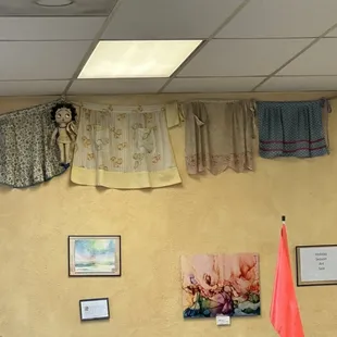 Betty Boop and aprons on the wall.