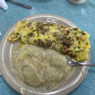 Veggie omelette, added sausage and side of grits.
