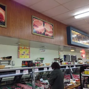 a woman shopping in a deli