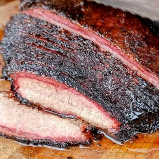 a close up of a bbqq on a cutting board