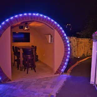 a patio with a table and chairs