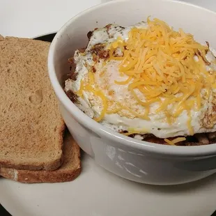 a bowl of eggs and bread