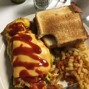 Absolutely the best Veggi omelet ever!!! With Texas toast and hash on the side