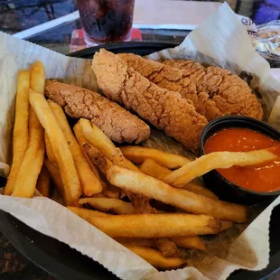 Fried chicken   tenders and fries .