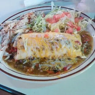 Breakfast burrito smothered with green chile