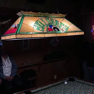 a pool table in a bar