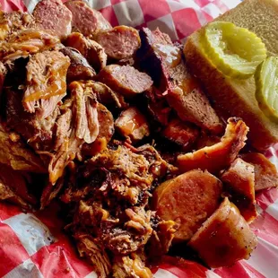 a pulled pork sandwich with a pickle