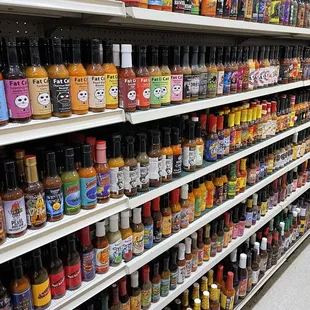 Talk about a hot sauce selection! This is just one row of many sauces to choose from.