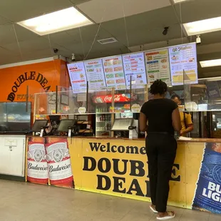 a woman standing at a counter