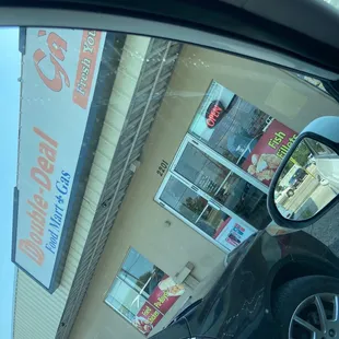 the reflection of a car in a side view mirror