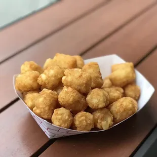 a basket of tater tots on a table