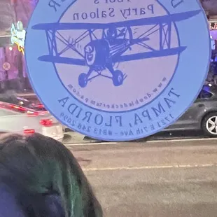 a woman standing in front of a bar