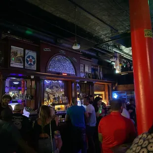 a crowd of people at a bar