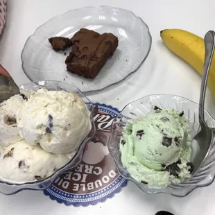 two bowls of ice cream and a banana