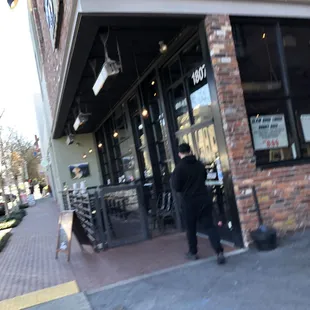 a man walking down the sidewalk