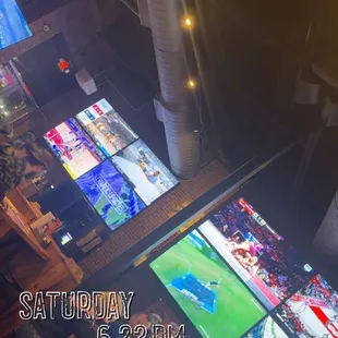 Dining area with many tvs all over