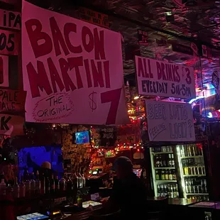 a bar with neon signs