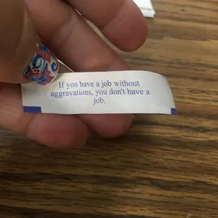 a hand holding a piece of paper