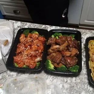 Left to right: sesame chicken, bourbon chicken, pork lo mein