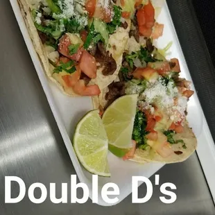 Loaded carne asada tacos. You MUST try them.