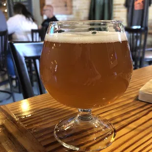 a glass of beer on a table