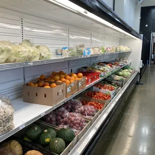 produce on shelves in a grocery store