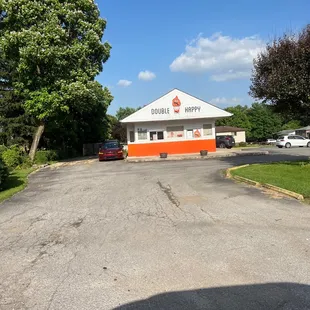 a parking lot with cars parked in front