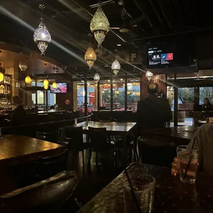 two people sitting at a bar