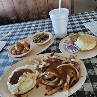 Hamburger steak with onions and gravy. Two sides, dessert and biscuit. $9.95.  GREAT DEAL!
