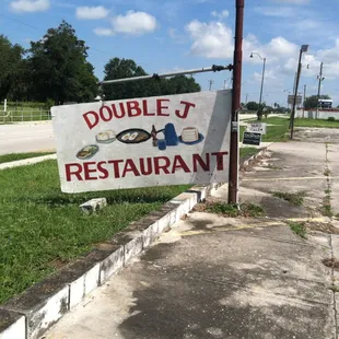 a double j restaurant sign