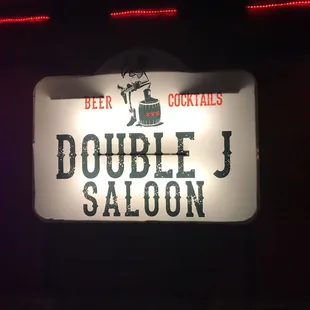 a sign for double j saloon