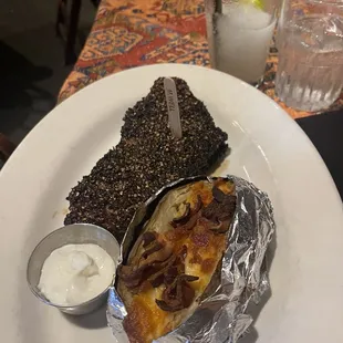 Black pepper steak with loaded baked potato