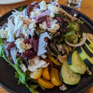 It&apos;s a big Greek Salad $11  Light spring greens,very  light balsamic.. Needs crispier greens + more tomatoes,  olives ;) 6-2023