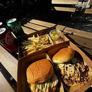 Smash and Philly Burger with side of fries.