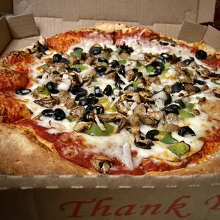 Large w/ onions, olives, bell peppers, mushroom &amp; sausage, good, but toppings only in middle.