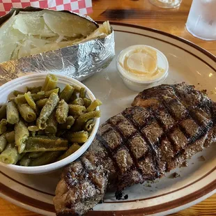 Ribeye special with green beans and HUGE potato! Yum!
