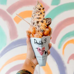 Honeydew &amp; Oreo soft serve with original bubble waffle, reese&apos;s pb cup and chocolate chips with condensed milk $10.50