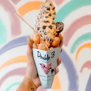 Honeydew &amp; Oreo soft serve with original bubble waffle, reese&apos;s pb cup and chocolate chips with condensed milk $10.50