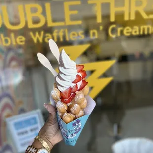 Soft serve swirl ice cream original bubble waffle cone with strawberries