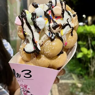 Original Bubble waffle with vanilla ice cream and mini marshmallows and chocolate sauce.