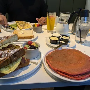 The Hangover, short stack of red velvet pancakes with toppings on the side. Florentine omelette, sourdough toast, Avocado &amp;Tequila sunrise.